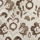 Tonic Living Paloma Fabric in Walnut, a coffee brown floral drapery fabric with bold blooms and scrolling leaves on an oatmeal beige ground.
