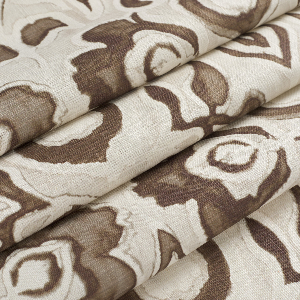 Tonic Living Paloma Walnut floral fabric shown as a Roman shade, featuring a stylized coffee brown botanical pattern on oatmeal beige.