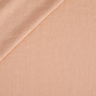 Tonic Living Pietra Double Width Linen in Salmon Pink, a soft salmon linen drapery fabric with subtle slub texture.