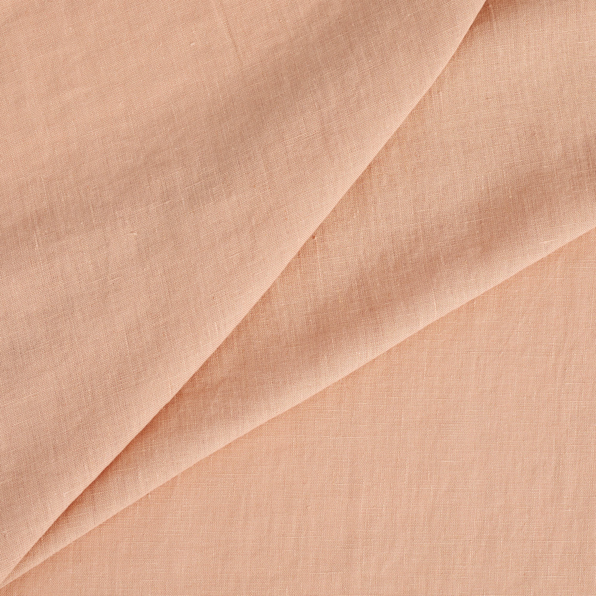 Tonic Living Pietra Salmon Pink double-width linen fabric with a lightweight drape and subtle slub texture.