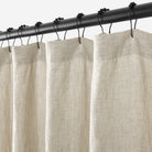 Close up of Tonic Living Positano Linen Shower Curtain showing buttonhole top in soft stone-grey linen.