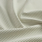 Tonic Living Refresh Sunbrella Hedge outdoor upholstery fabric with a clean green and white stripe design.
