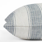 Revitalize navy blue and off-white striped indoor/outdoor throw pillow from Tonic Living, close-up side view.