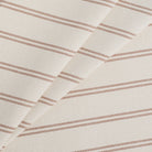 Rexton Stripe Merlot high-performance upholstery fabric in burgundy red and beige ticking stripes, durable home decor textile by Tonic Living.