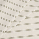 Tonic Living Rexton Stripe Moss high-performance upholstery fabric in olive green and beige ticking stripes, durable home decor textile.