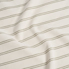 Durable Tonic Living Rexton Stripe Moss upholstery fabric featuring classic horizontal stripes in moss green and beige, timeless home decor fabric.