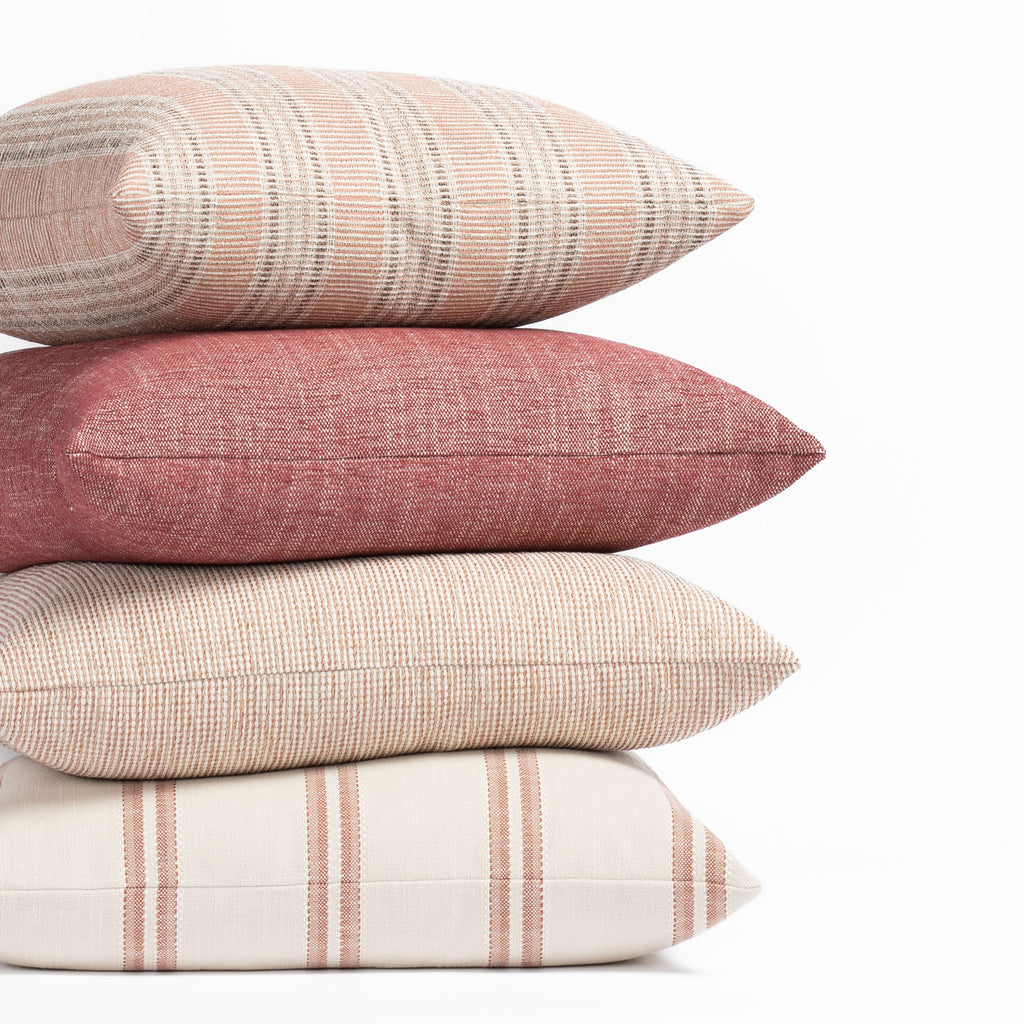 Earthy red, terracotta clay and sandy taupe outdoor pillow collection from Tonic Living