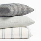 Indigo blue, mist blue, and white outdoor Tonic Living throw pillows