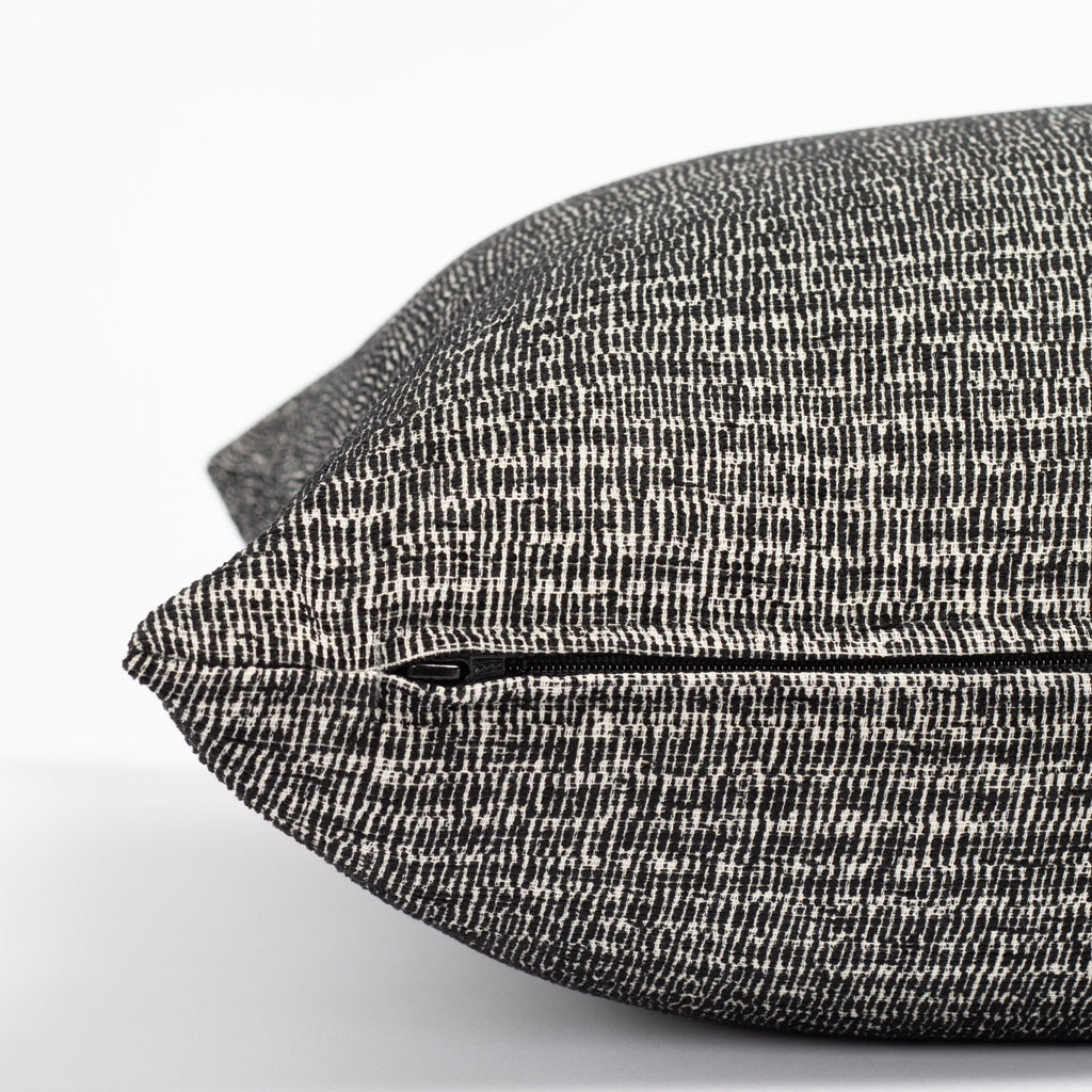 a black and white chenille textured micro patterned pillow : zipper detail