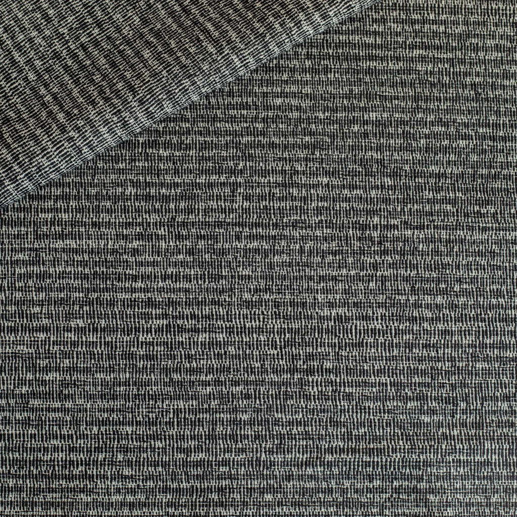 a black and off-white textured patterned upholstery fabric