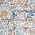 an aqua, sage, marigold, mauve and stone blue watery floral print fabric