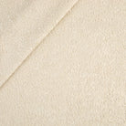 Tonic Living Rupert Parchment multi-use upholstery fabric featuring a soft cream bouclé texture.