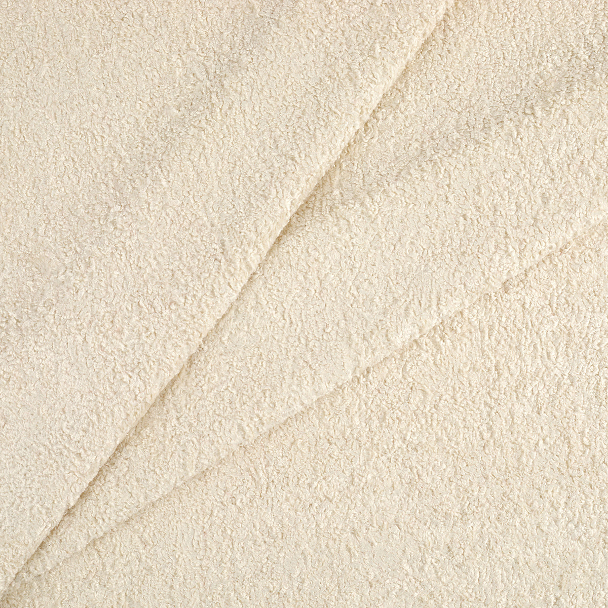 Tonic Living Rupert Fabric in Parchment, a neutral off-white textured upholstery fabric with a plush bouclé look.