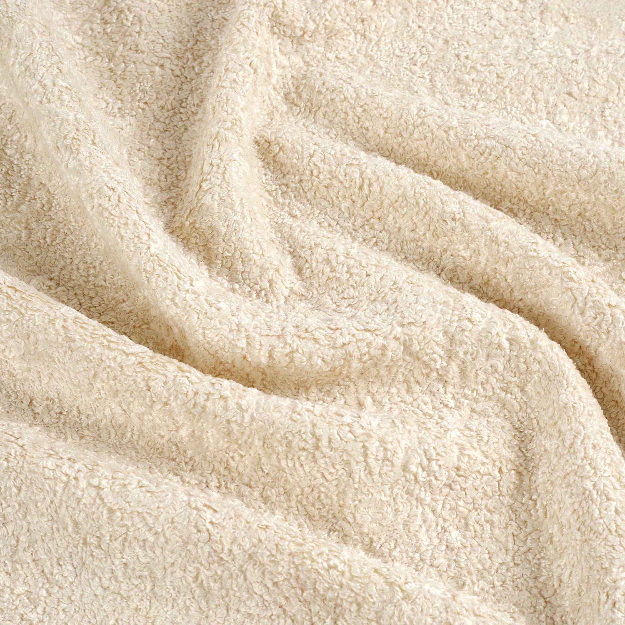 Tonic Living Rupert Fabric in Parchment, a creamy off-white bouclé upholstery fabric with cozy woven texture.