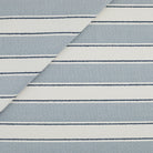 Tonic Living Sentiment Sunbrella Denim indoor/outdoor upholstery fabric featuring a wide stripe with navy accents.