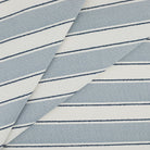 Tonic Living Sentiment Sunbrella Outdoor Fabric in Denim, a blue and white indoor/outdoor upholstery fabric with bold stripe.