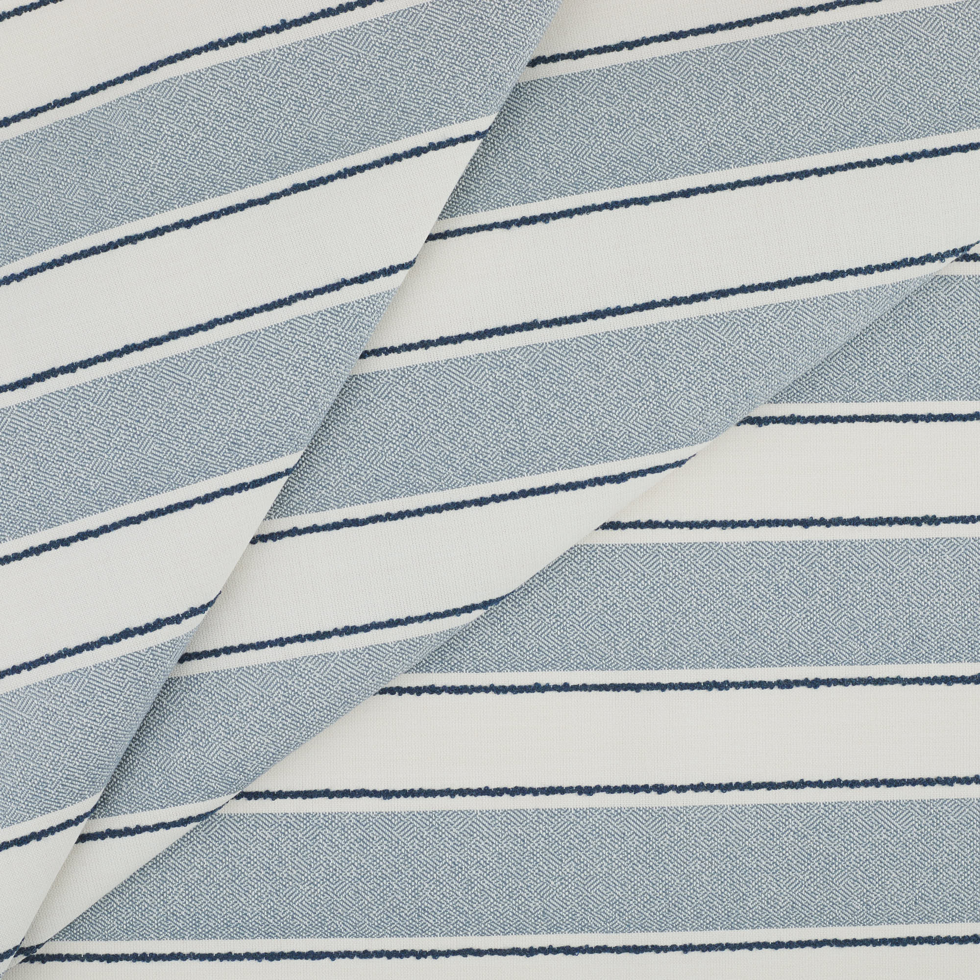 Tonic Living Sentiment Sunbrella Outdoor Fabric in Denim, a blue and white indoor/outdoor upholstery fabric with bold stripe.