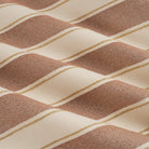 Tonic Living Sentiment Sunbrella Terracotta performance fabric showing movement in a bold terracotta striped design.