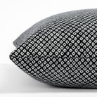 Shibori Classic, a black and white dotted pattern indoor/outdoor pillow from Tonic Living: close-up side view.