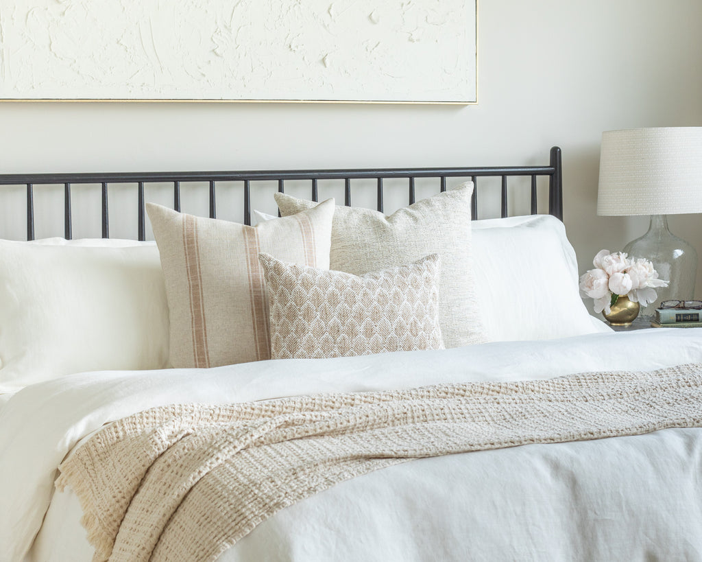 Oatmeal and Rust Bed Pillow Pairing: a bedscape of three oatmeal, burlap and rust throw pillows