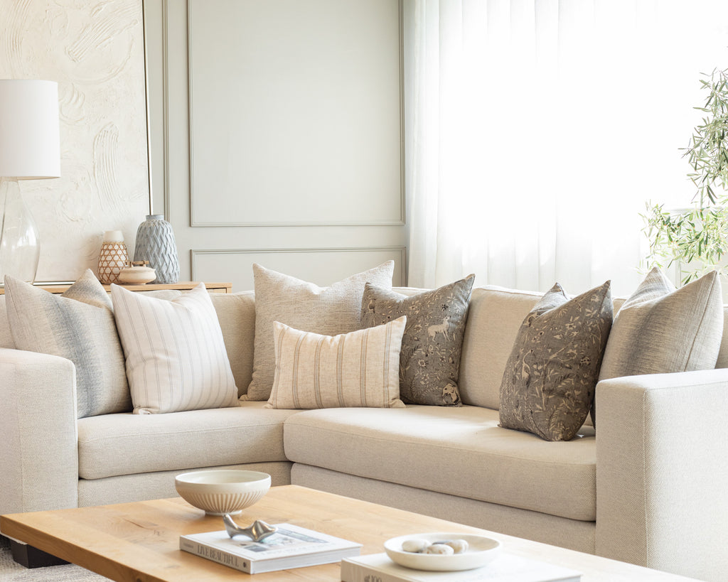 Smokey Blue and white sectional pillow pairing : a collection of throw pillows mixing a variety of stripes, textured solids with vintage botanical print