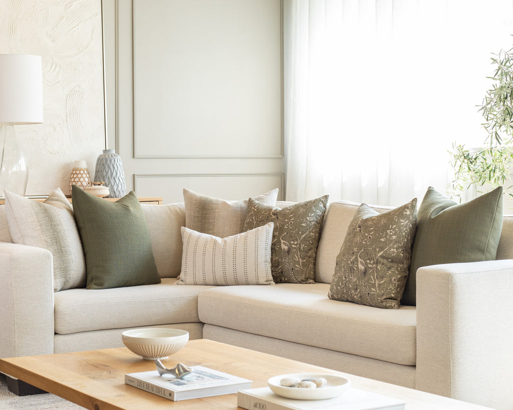 Mossy greens sectional pillow pairing : a collection of throw pillows mixing a variety of stripes, textured solids with vintage botanical print