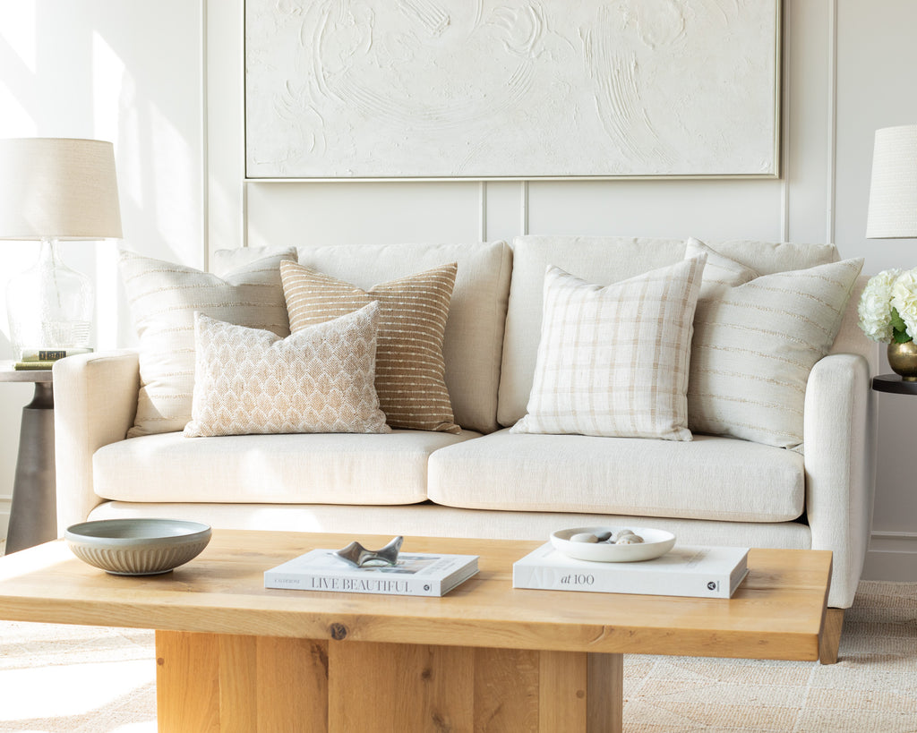 Light Earthy Neutrals: a combination of cream, greige and burlap throw pillows mixing a variety of simple earthy stripes with a classic check and woven, small scale wheat pattern. 