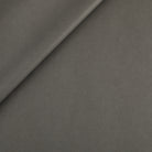 Tonic Living Smythe Faux Leather Fabric in Charcoal, a dark grey performance upholstery fabric with the rich character of genuine leather.