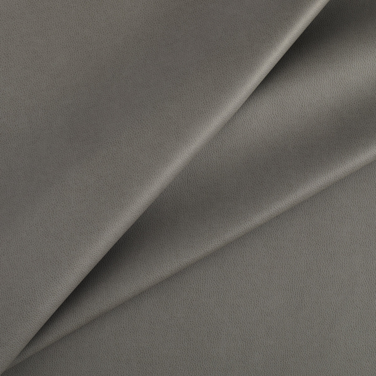 Tonic Living Smythe Faux Leather Fabric in Charcoal, a deep charcoal high-performance upholstery fabric with a natural leather look.