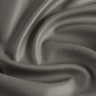 Tonic Living Smythe Charcoal high-performance faux leather fabric featuring a deep charcoal colour and natural-looking grain.