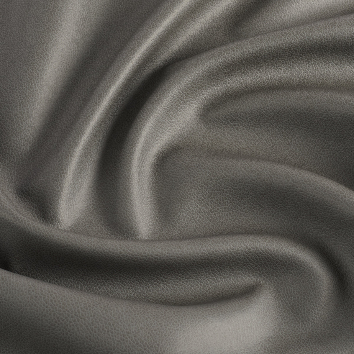 Tonic Living Smythe Charcoal high-performance faux leather fabric featuring a deep charcoal colour and natural-looking grain.