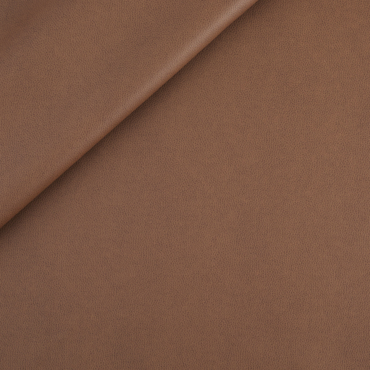 Tonic Living Smythe Faux Leather Fabric in Cognac, a deep brown performance upholstery fabric with the rich character of genuine leather.