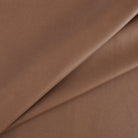 Tonic Living Smythe Faux Leather Fabric in Cognac, a deep cognac brown high-performance upholstery fabric with a natural leather look.