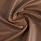 Tonic Living Smythe Cognac high-performance faux leather fabric featuring a rich brown colour and natural-looking grain.