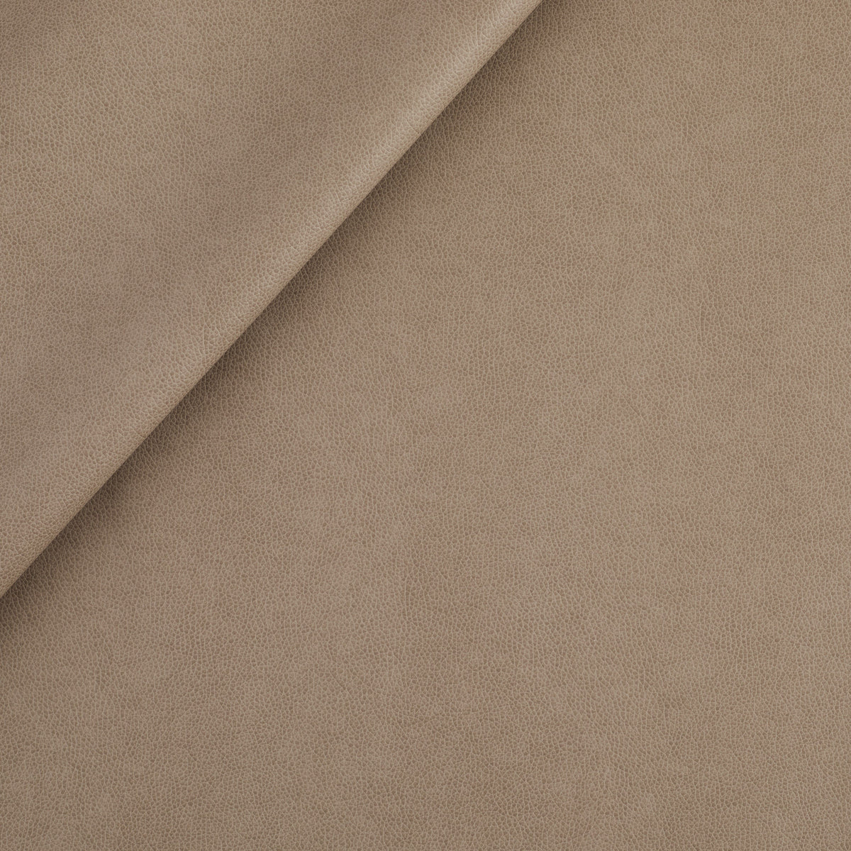 Tonic Living Smythe Faux Leather Fabric in Portobello, a taupe brown performance upholstery fabric with the rich character of genuine leather.