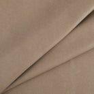 Tonic Living Smythe Faux Leather Fabric in Portobello, a taupe brown high-performance upholstery fabric with a natural leather look.