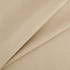Tonic Living Smythe Faux Leather Fabric in Sandstone, a sandy beige high-performance upholstery fabric with a natural leather look.