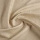 Tonic Living Smythe Sandstone high-performance faux leather fabric featuring a warm neutral beige colour and natural-looking grain.