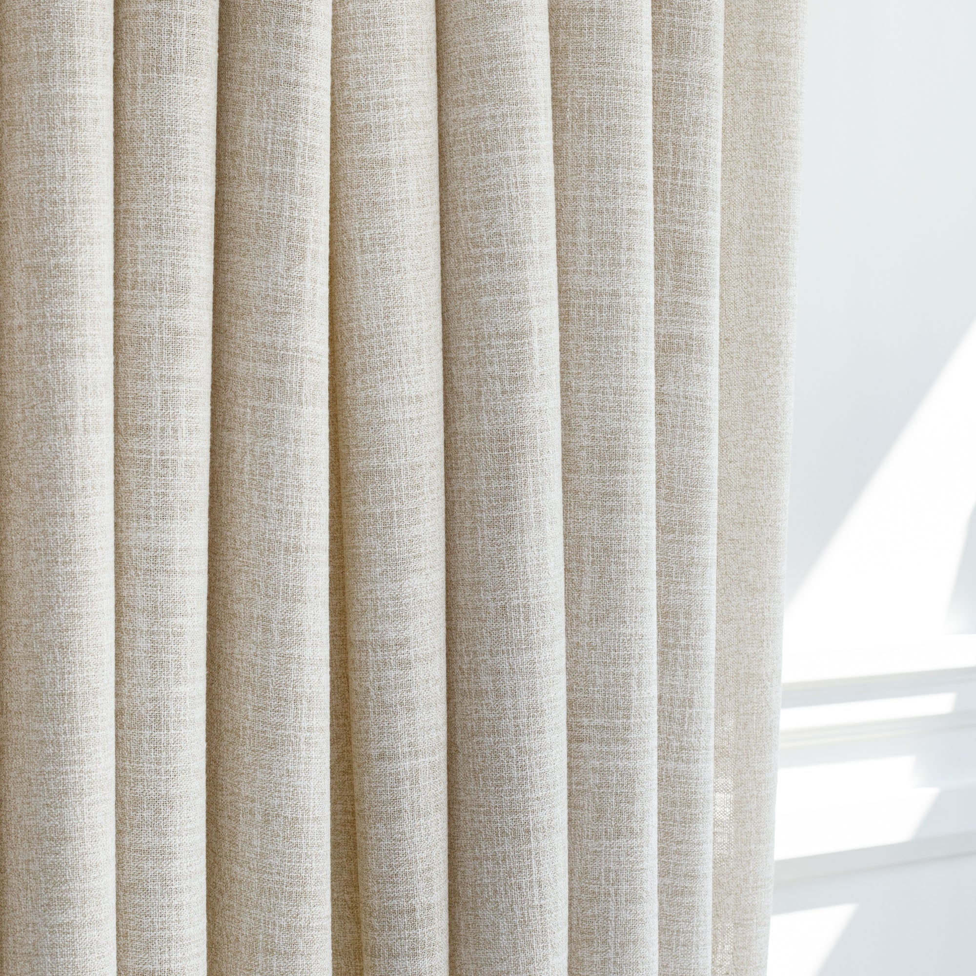 a semi sheer wheat toned double width drapery fabric from Tonic Living