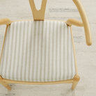 Tonic Living Somerset Stripe Oatmeal upholstery fabric on a dining chair seat in sand and beige stripe.