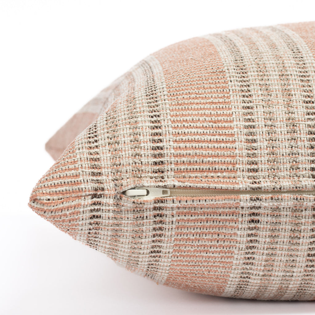 an earthy  terracotta pink, brown and sand stripe outdoor pillow : close up zipper view