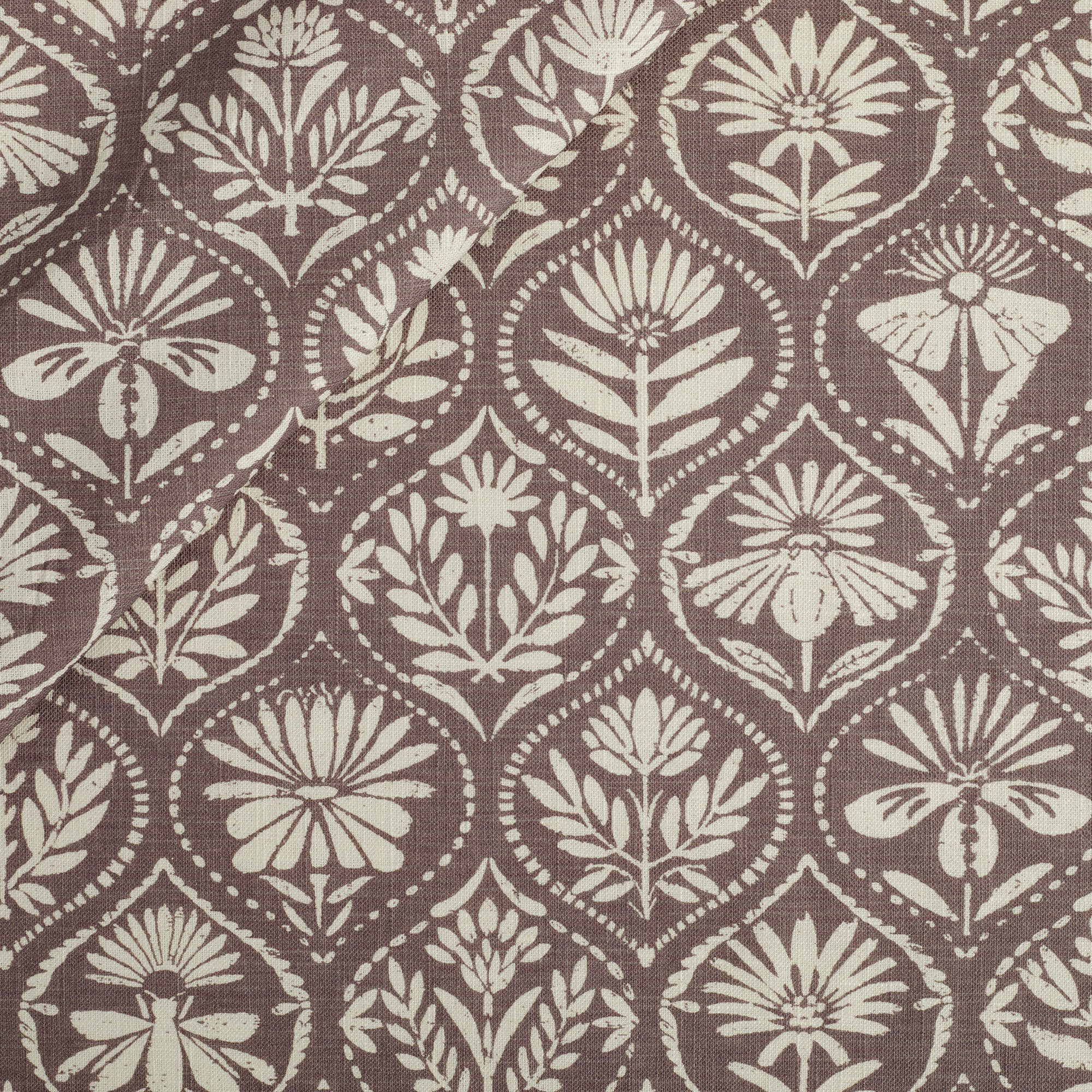 Tonic Living Stella Fabric in Mauve, an earthy purple and beige drapery fabric with block print medallion pattern.