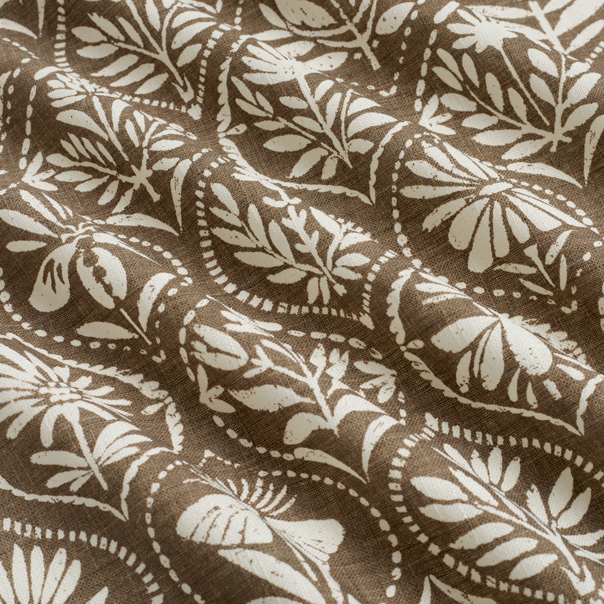 Tonic Living Stella Mocha drapery fabric shown with movement highlighting mocha brown and natural medallion pattern.