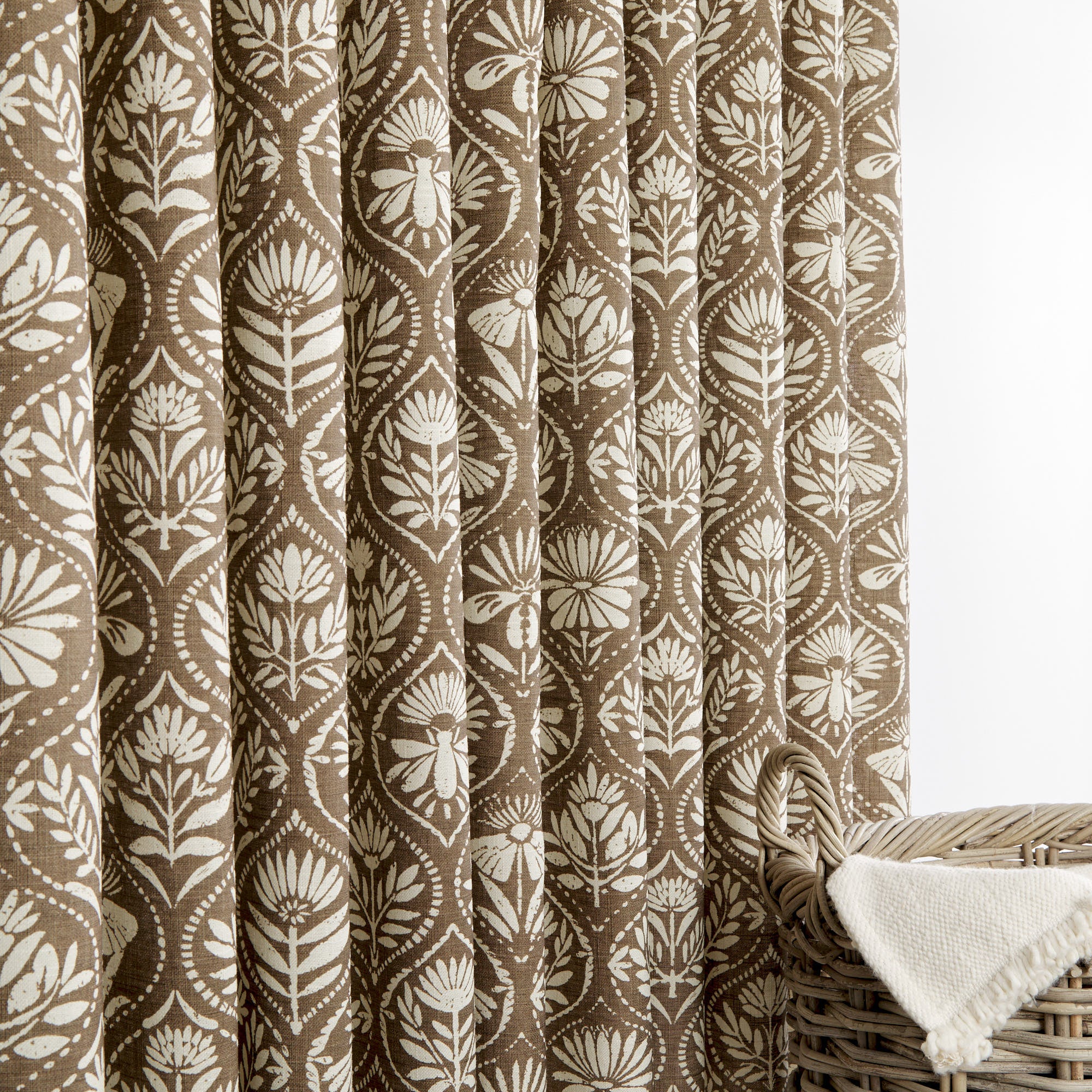 Tonic Living Stella Mocha curtain fabric shown as drapery in brown and beige block print design.