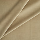 Tonic Living Sterling Velvet Bark upholstery fabric featuring warm light brown and golden tan tones with a refined velvet texture.