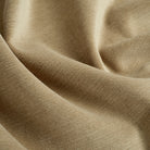 Close up of Tonic Living Sterling Velvet Bark fabric showing tobacco brown velvet, fine linear texture, and bronzed colour variation.