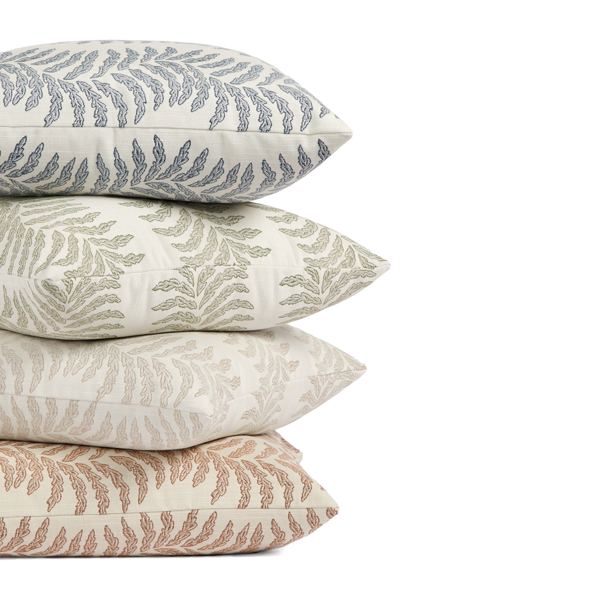 Tonic Living Swoon pillow collection in denim blue, sage green, sand, and terracotta featuring botanical stripe designs.
