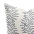 Close up of Tonic Living Swoon outdoor cushion showing blue and white stylized fern stripe detail.