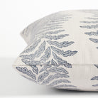 Side view of Tonic Living Swoon Denim decorative cushion highlighting its flowing blue botanical stripe design.