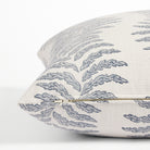 Side zipper detail of Tonic Living Swoon 20x20 outdoor toss pillow in blue and white stripe.